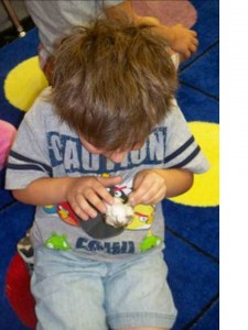 kid playing with cotton