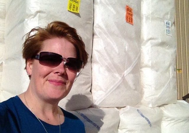 me in front of a few bales of cotton